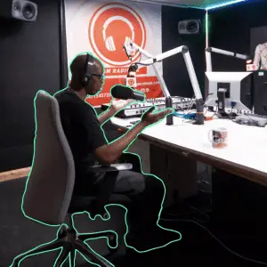 Independent podcaster in private sound studio at Mainyard Studios, London