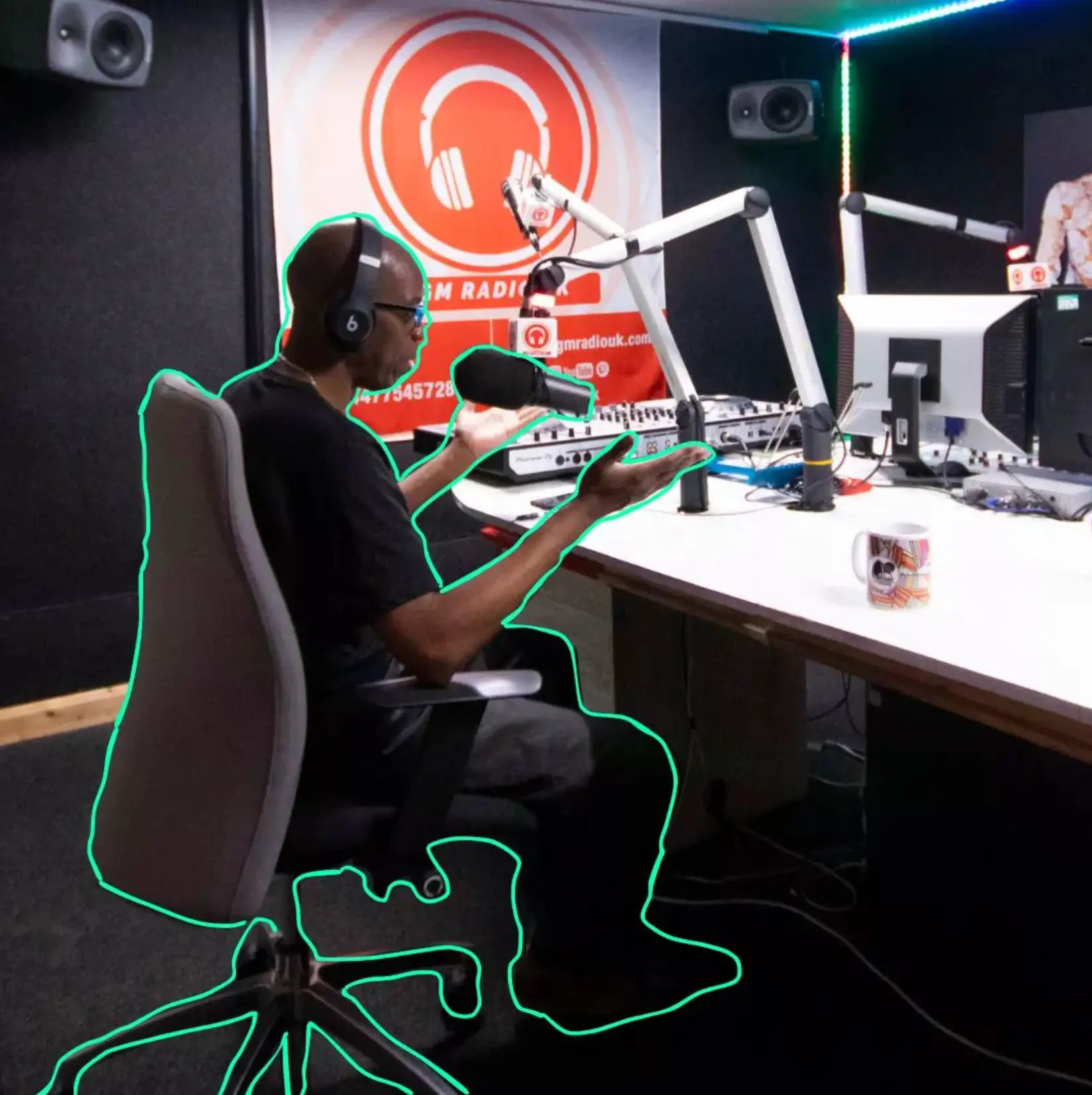 Independent podcaster in private sound studio at Mainyard Studios, London