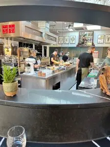 view of bustling kitchen at Cornerstone Restaurant Hackney Wick