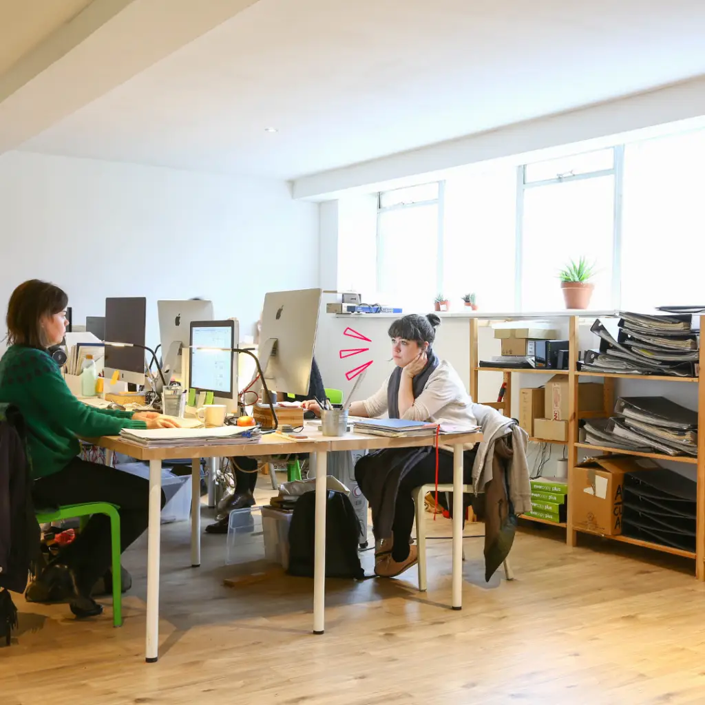 bright private office with workers at desks on computers in Mainyard Studios East London
