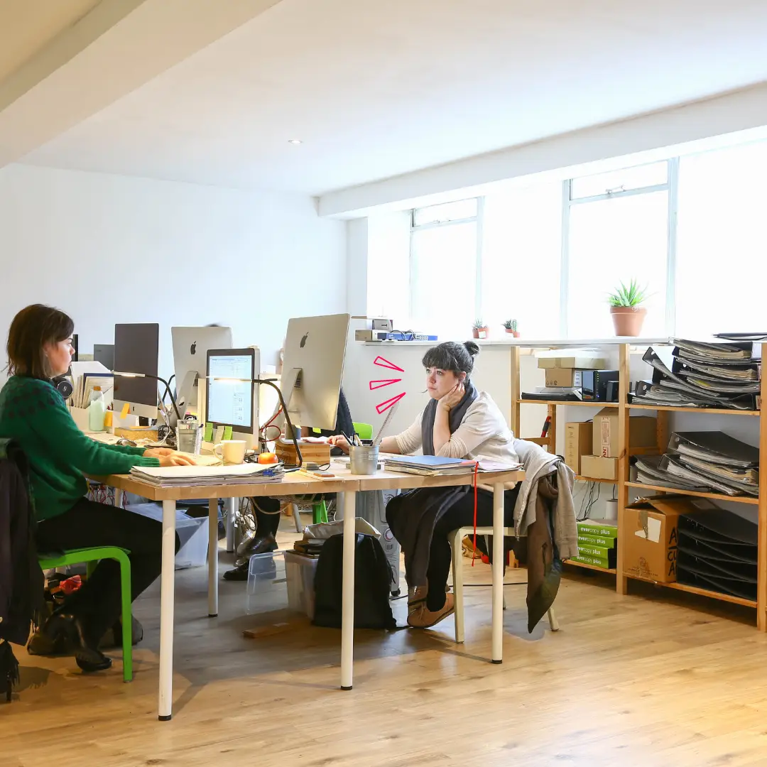 bright private office with workers at desks on computers in Mainyard Studios East London