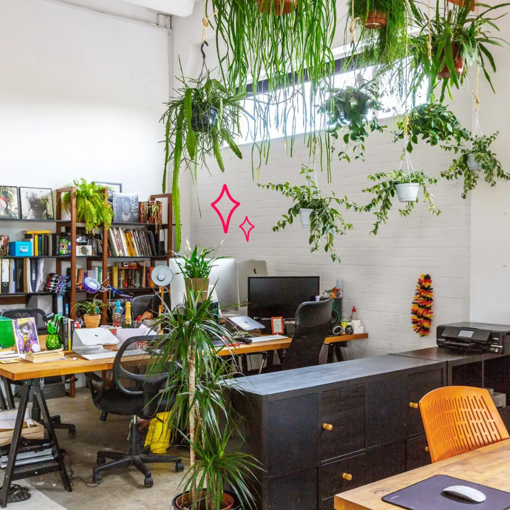Bright warehouse style office in east london, with plenty of green plants