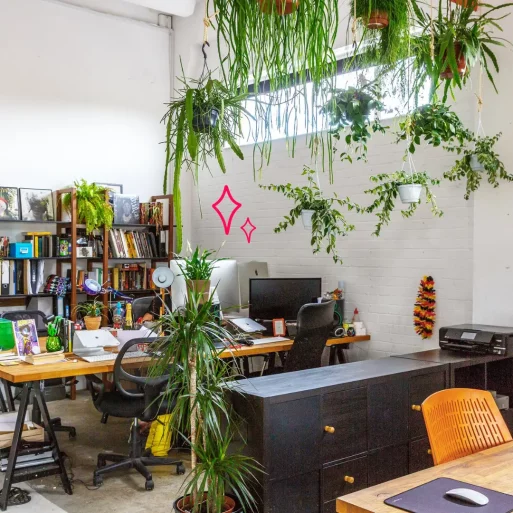 Bright warehouse style office in east london, with plenty of green plants